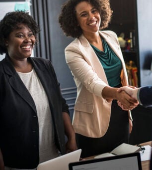 Business partners shaking hands in agreement